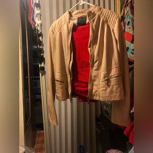 Leather jacket with cheetah print inside. Red pants